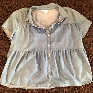 Loose button up denim top.